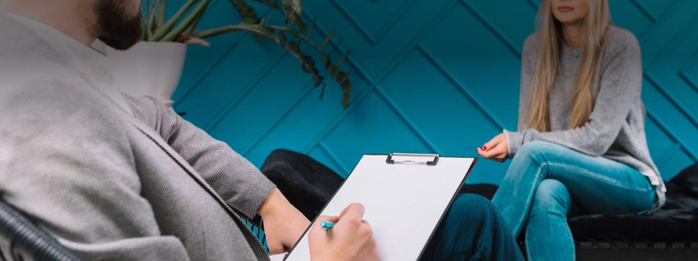 Picture of man writing on a clipboard