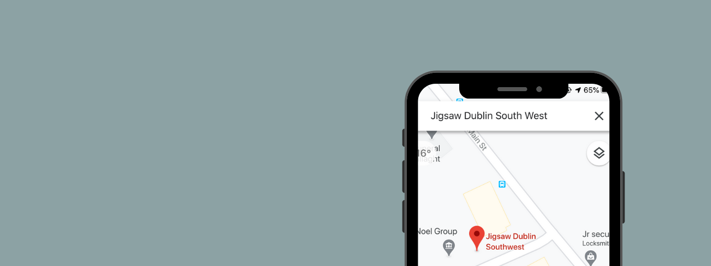 Grey background with an iphone that's searching Dublin South West on maps