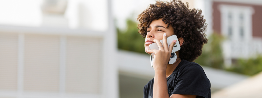 Girl on the phone looking into the distance