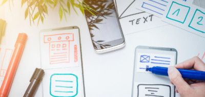 Information A person drawing multiple elements of a phone application