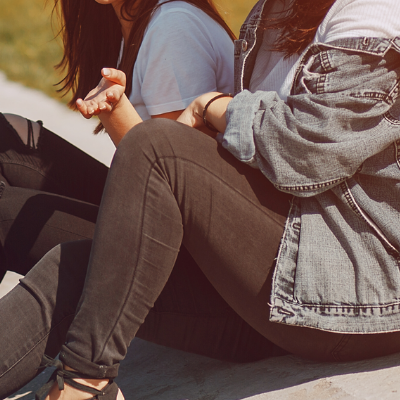 Why-do-people-self-harm Close up of a a person comforting another, specifically a hand on their shoulder