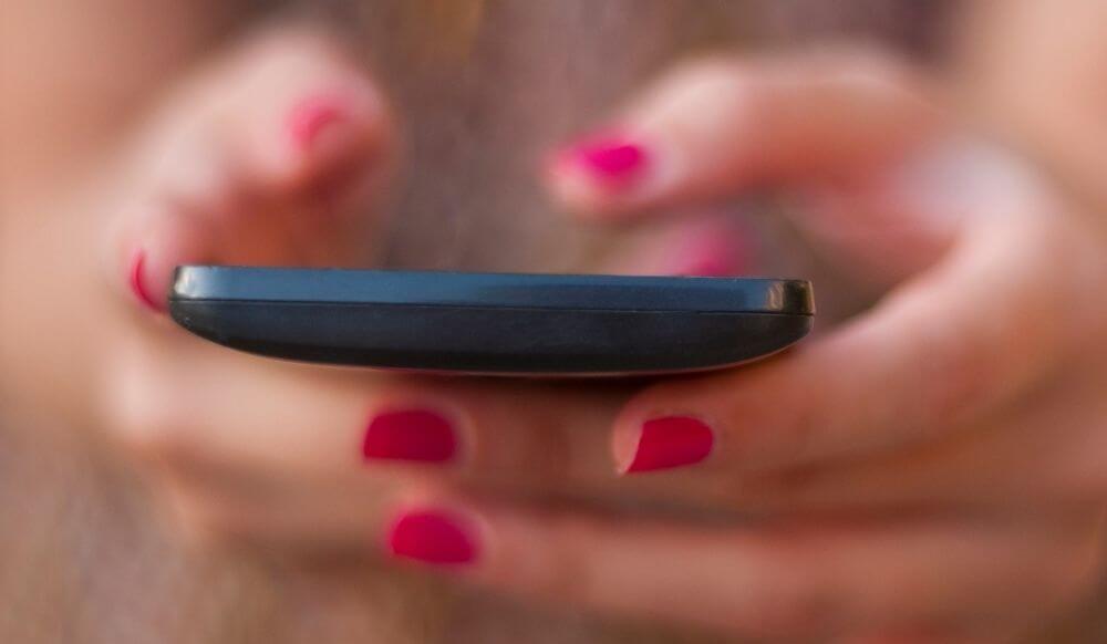 female-hand-using-smart-phone