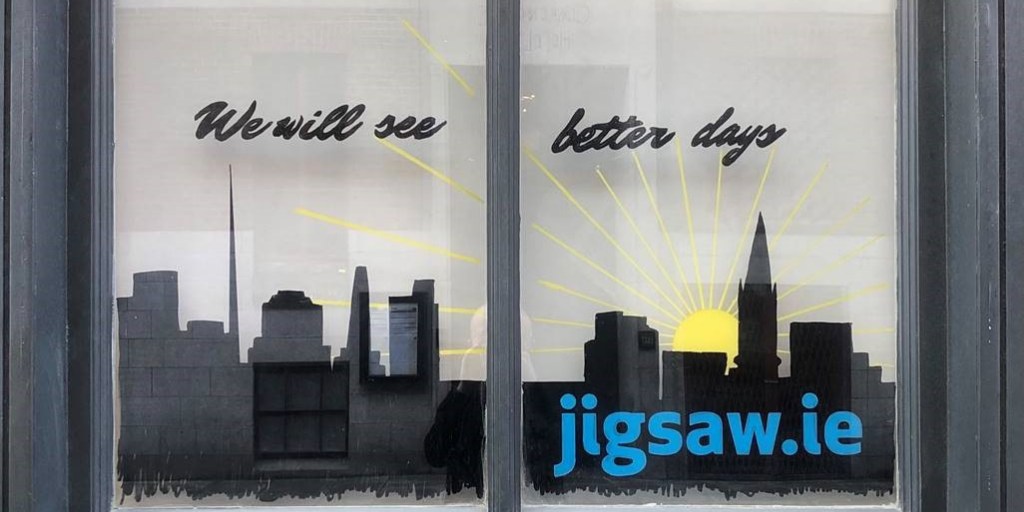 An image of a window display that says we will see better days