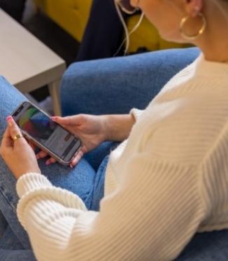 Person looking at Jigsaw's website on their phone