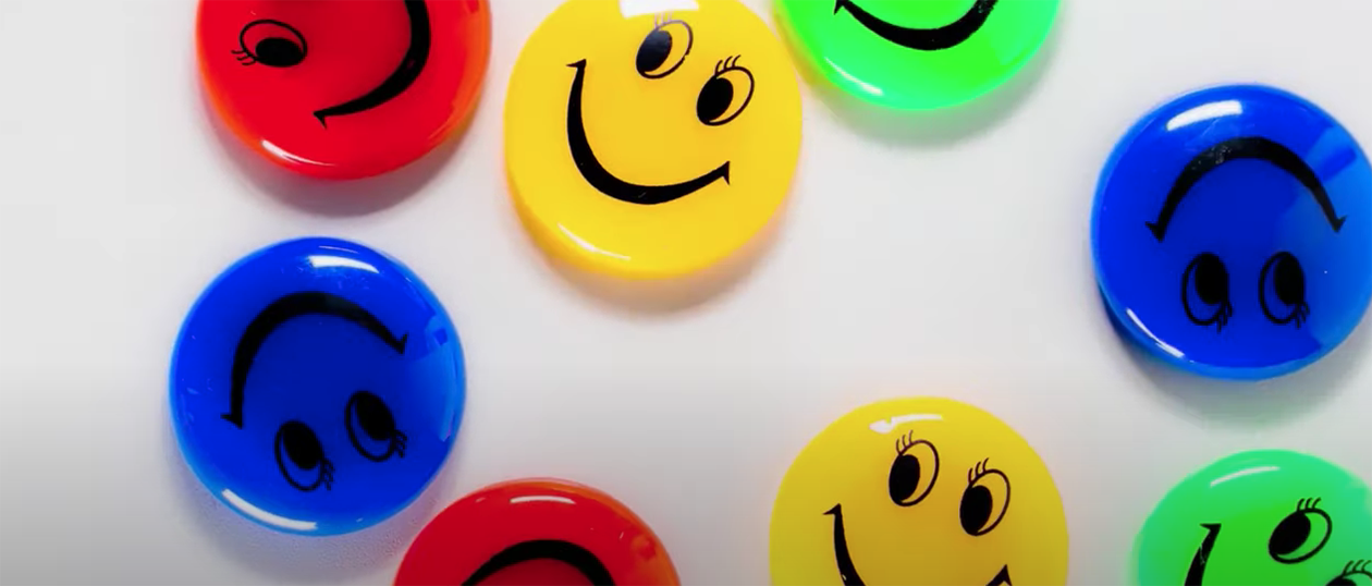 assorted coloured plastic rounded smiley faces