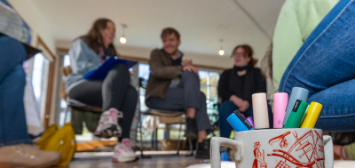 theme-based-resources a group of people sitting and laughing out of focus